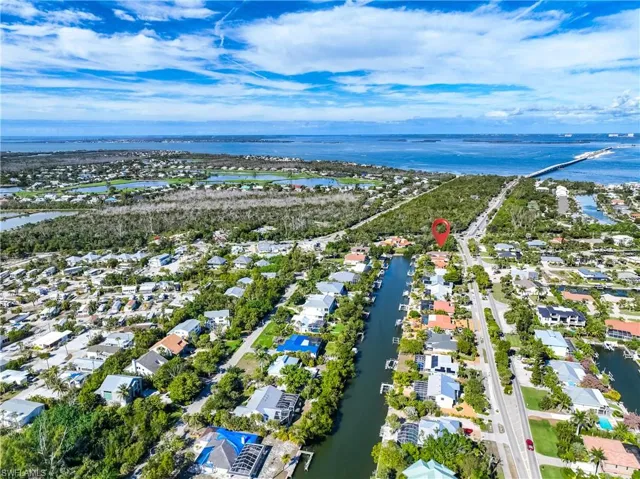 View of property location featuring nearby suburban area and a large body of water