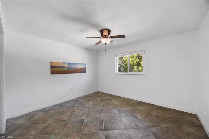 Full bathroom with two vanities, light wood-type flooring, recessed lighting, and a ceiling fan