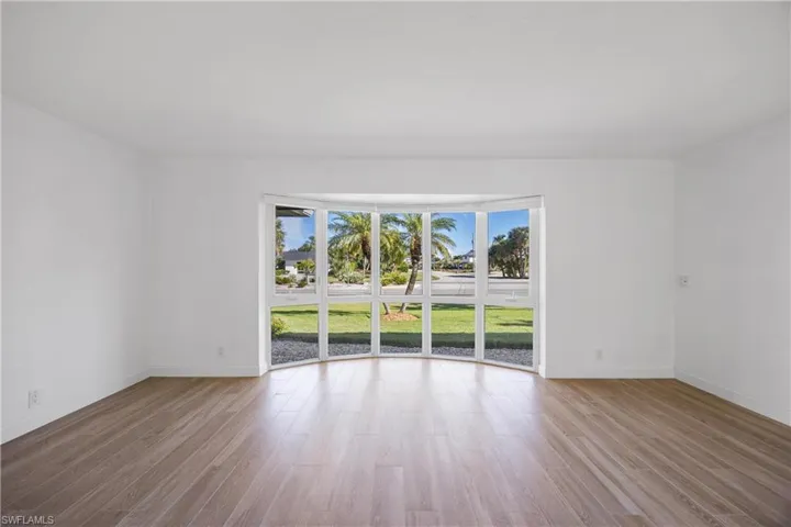 Unfurnished living room featuring light wood-style floors