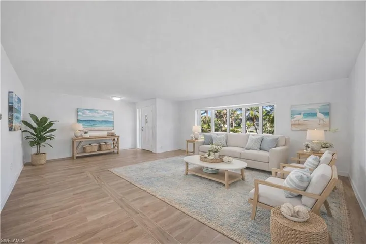 Spare room with light wood-style floors and baseboards