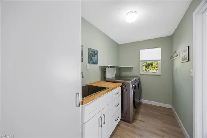 Bathroom featuring a stall shower and light wood-type flooring