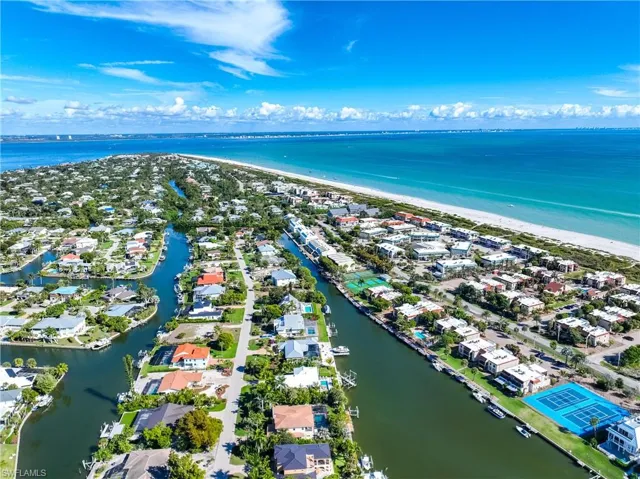 Aerial view of residential area featuring a large body of water