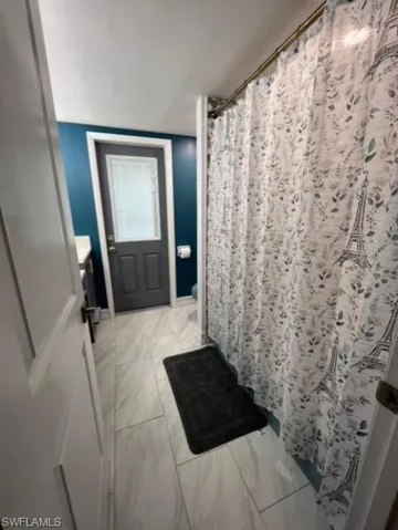Bathroom featuring tile floors