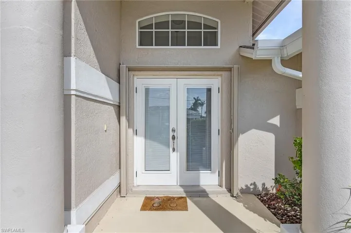 Entrance to property featuring french doors