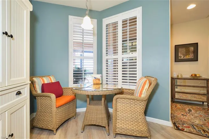 Living area with wood finished floors and baseboards