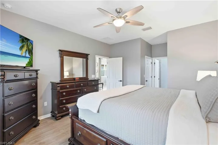 Neutral tone walls complement wood-finish flooring