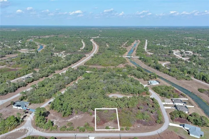 Aerial overview of property's location featuring a heavily wooded area