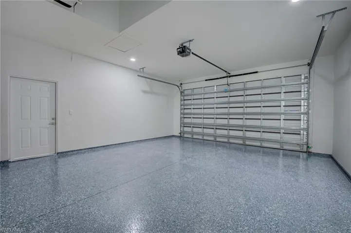 Garage featuring a garage door opener