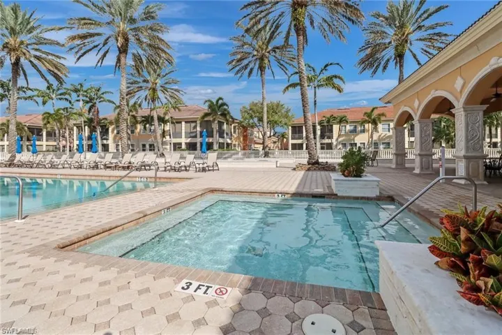 View of hot tub and pool