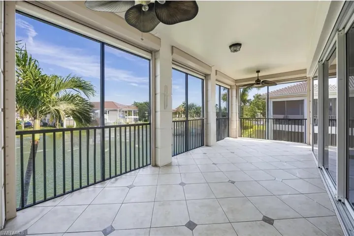 Sunroom / solarium featuring ceiling fan