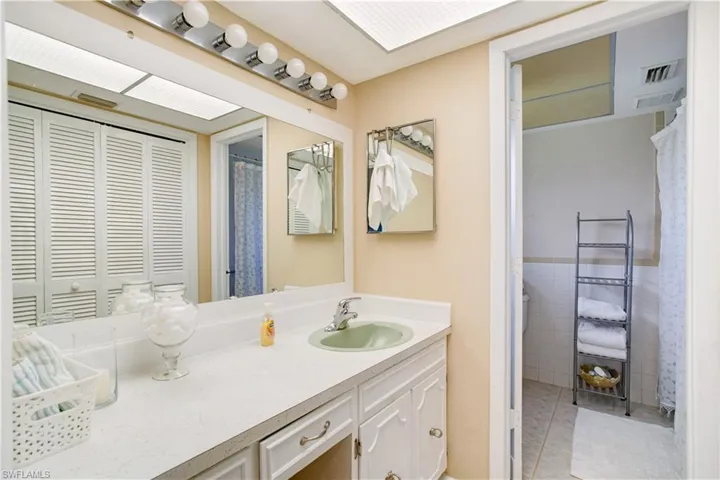 Bathroom featuring tile flooring and vanity