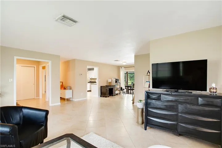 Living room with light tile flooring