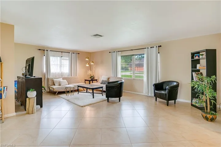 Living room with light tile floors