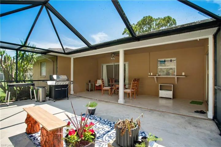 Unfurnished sunroom featuring ceiling fan