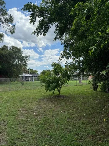 View of yard with a rural view