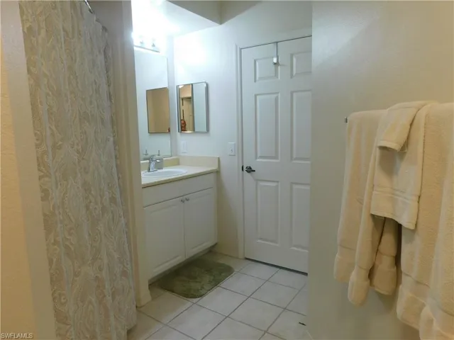 Bathroom with vanity and tile patterned floors