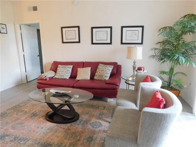 Living room with wood-type flooring