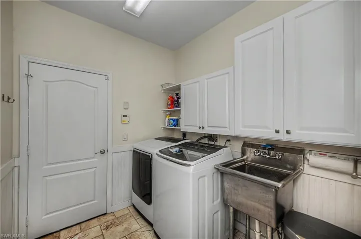 Large indoor Laundry with plenty of storage