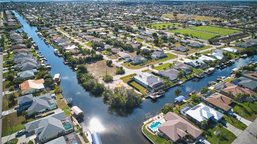 View of property location with nearby suburban area and a large body of water