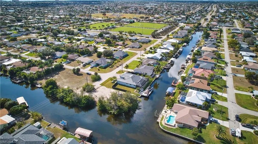 View of property location with nearby suburban area and a large body of water