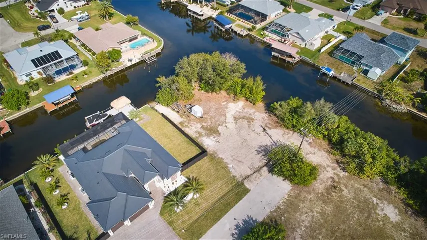 Aerial view of residential area with a large body of water