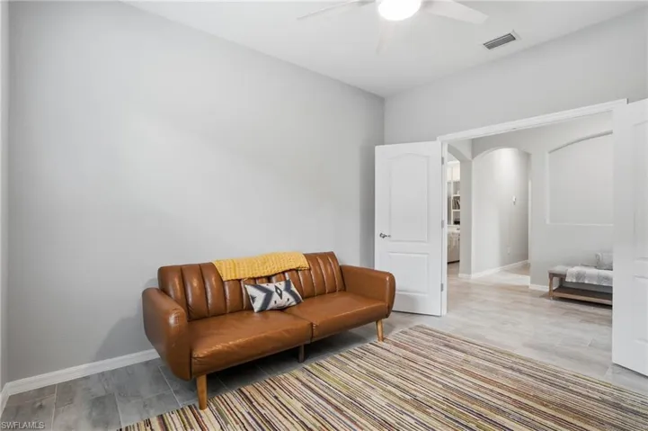Spacious den with plank tile flooring