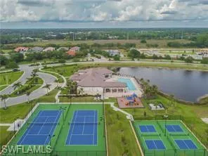 Aerial overview of property's location featuring a large body of water