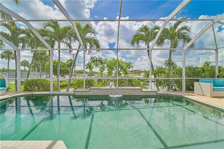 View of pool with glass enclosure