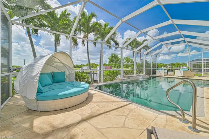 View of pool featuring a patio and a lanai