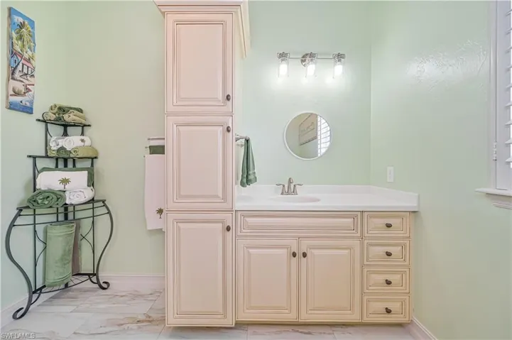 Bathroom with vanity and tile patterned flooring