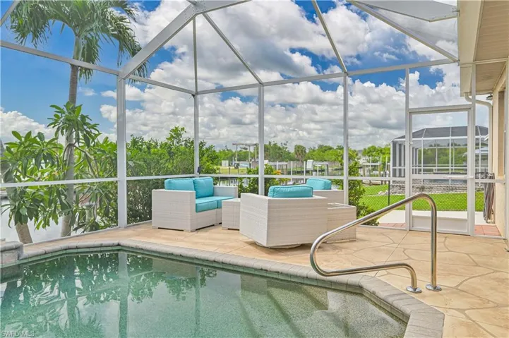 View of pool with a patio area, a lanai, and outdoor lounge area