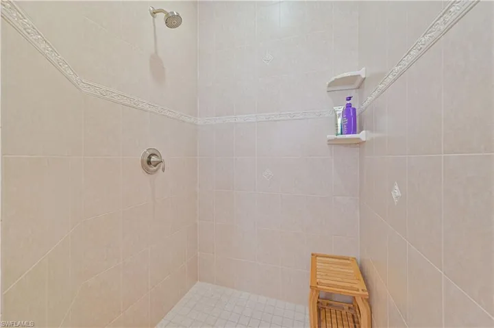 Bathroom featuring tiled shower