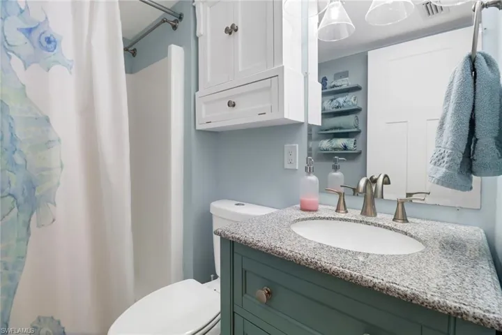 Bathroom with vanity and toilet