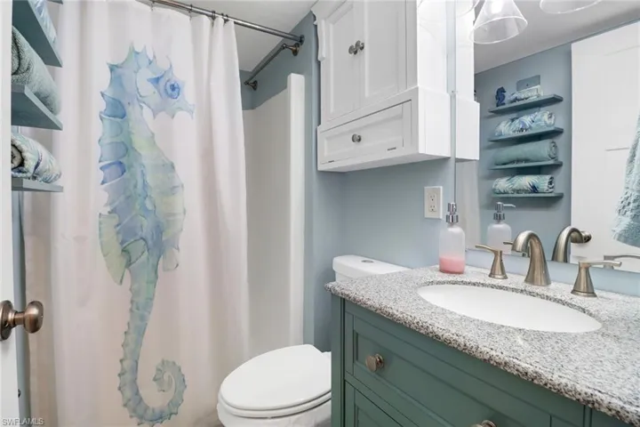 Bathroom with toilet and vanity