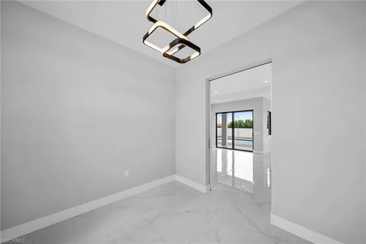 Unfurnished room featuring light tile patterned floors