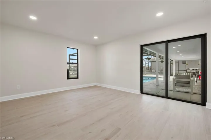 Empty room with light hardwood / wood-style flooring