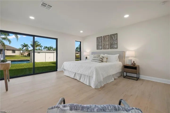 Bedroom with access to exterior and light wood-type flooring
