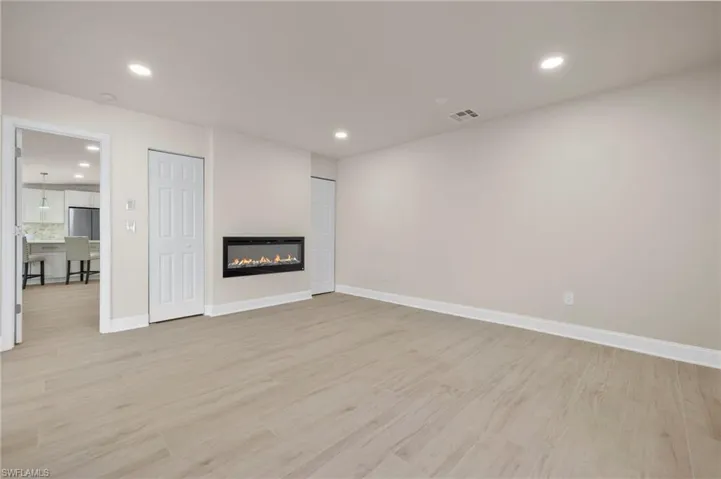 Unfurnished living room featuring light hardwood / wood-style floors
