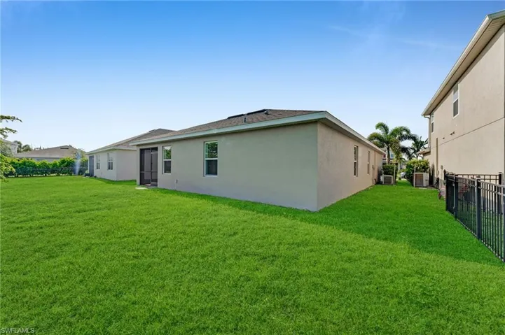 Back of house with stucco siding