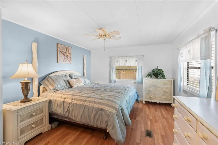 Bedroom featuring light hardwood / wood-style flooring and ceiling fan