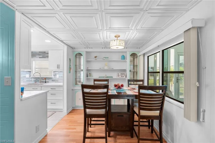 Dining space featuring light hardwood / wood-style floors and sink