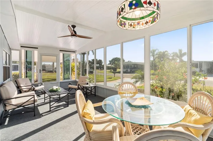 Sunroom / solarium with ceiling fan and lofted ceiling