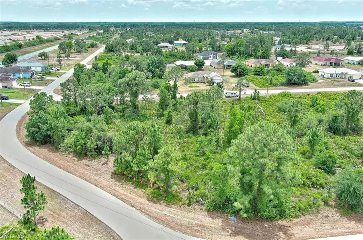 Aerial view of residential area with a tree filled landscape