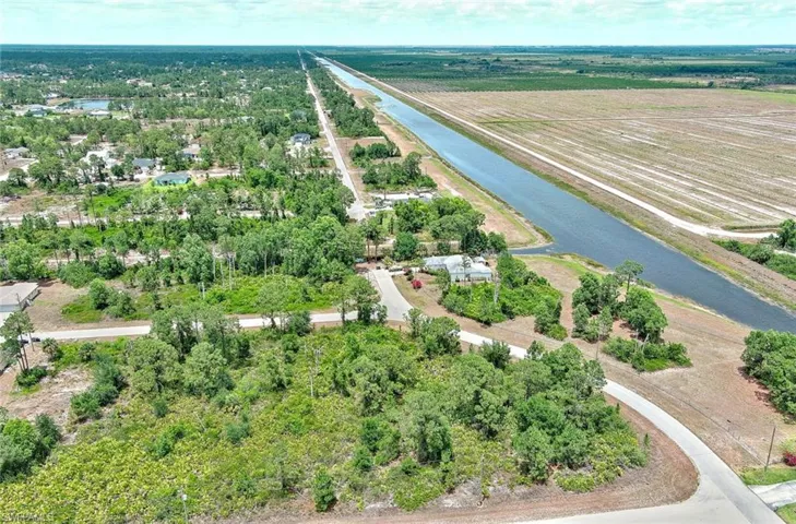 Aerial view of sparsely populated area featuring abundant farmland