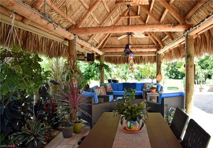 View of patio with outdoor lounge area and a gazebo