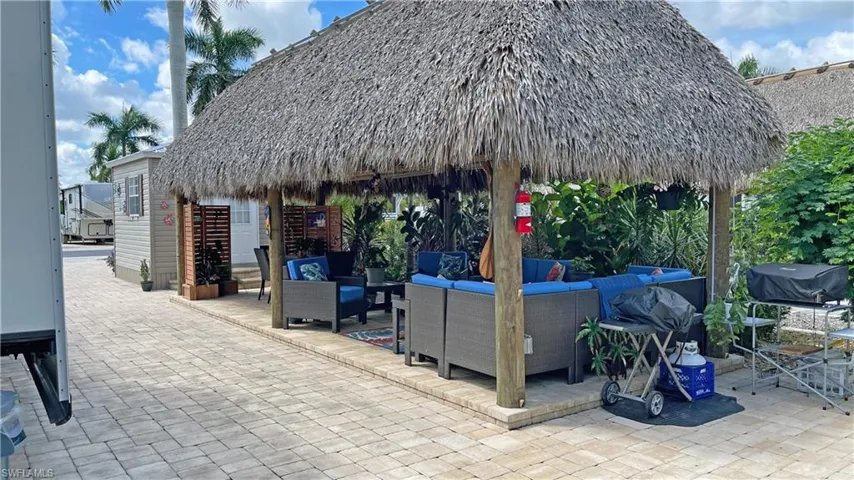 View of patio featuring outdoor lounge area and a gazebo