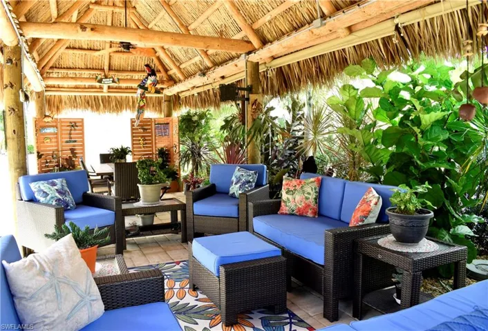 View of patio featuring an outdoor living space, ceiling fan, and a gazebo