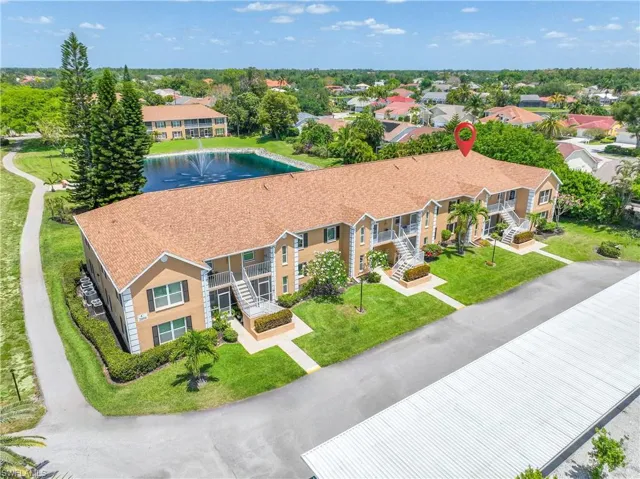 Well kept building in quiet section of Crown Pointe with lake view