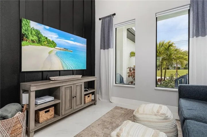 Home theater room with a healthy amount of sunlight.
