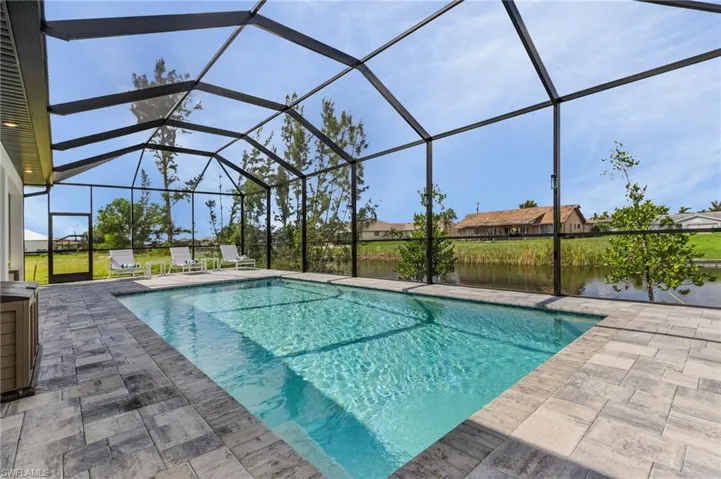Pool with a patio area and a lanai